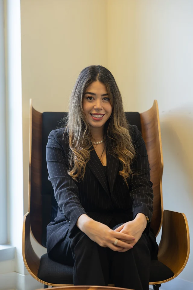 Eloisa Pino seated in an office chair.